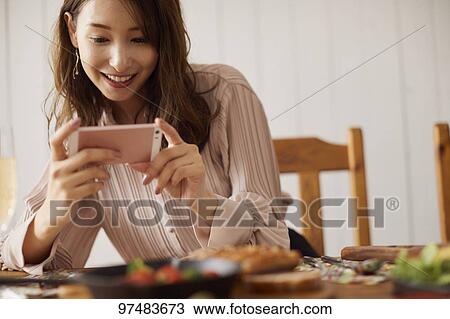 Japanese woman having home party View Large Photo Image Stock Image - Japanese woman having home party. Fotosearch