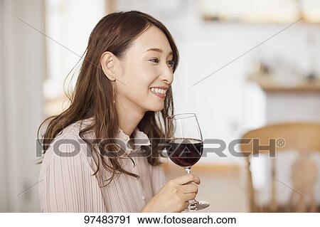 Japanese woman having home party View Large Photo Image Stock Image - Japanese woman having home party. Fotosearch