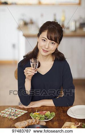 Japanese woman having home party View Large Photo Image Stock Photo - Japanese woman having home party. Fotosearch