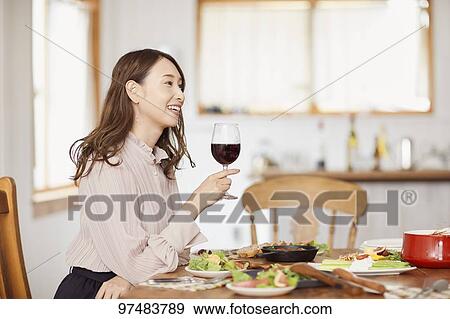 Japanese woman having home party View Large Photo Image Stock Photo - Japanese woman having home party. Fotosearch