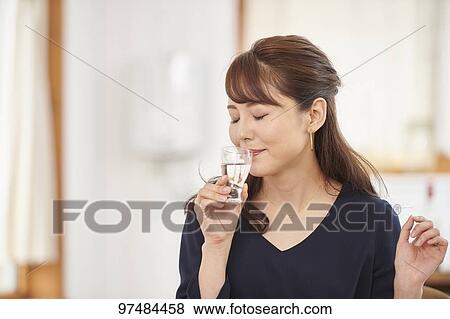 Japanese woman having home party View Large Photo Image Stock Photo - Japanese woman having home party. Fotosearch