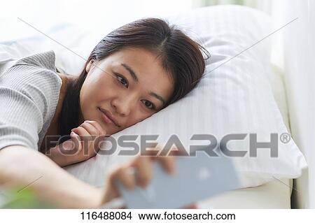 Japanese woman in bed View Large Photo Image Picture - Japanese woman in bed. Fotosearch