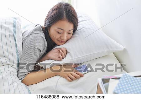 Japanese woman in bed View Large Photo Image Stock Photo - Japanese woman in bed. Fotosearch