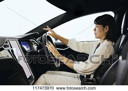 Japanese woman in self driving car View Large Photo Image Stock Image - Japanese woman in self driving car. Fotosearch