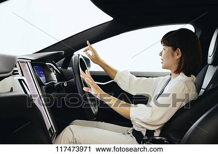Japanese woman in self driving car View Large Photo Image Stock Image - Japanese woman in self driving car. Fotosearch