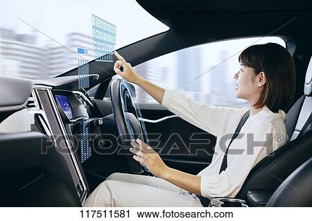Japanese woman in self driving car View Large Photo Image Stock Image - Japanese woman in self driving car. Fotosearch
