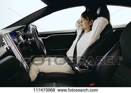 Japanese woman in self driving car View Large Photo Image Stock Photo - Japanese woman in self driving car. Fotosearch