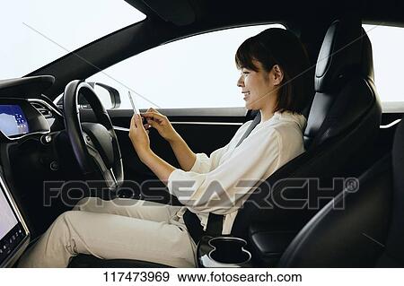 Japanese woman in self driving car View Large Photo Image Stock Photo - Japanese woman in self driving car. Fotosearch