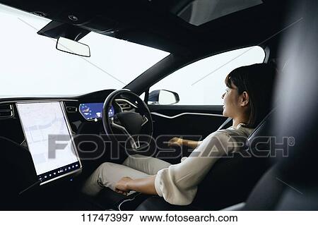 Japanese woman in self driving car View Large Photo Image Stock Photo - Japanese woman in self driving car. Fotosearch