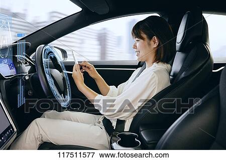 Japanese woman in self driving car View Large Photo Image Stock Photo - Japanese woman in self driving car. Fotosearch