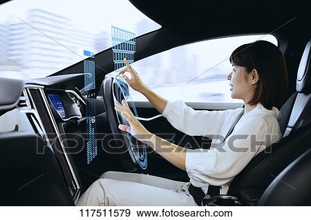 Japanese woman in self driving car View Large Photo Image Stock Photo - Japanese woman in self driving car. Fotosearch