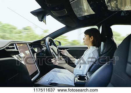 Japanese woman in self driving car View Large Photo Image Stock Photo - Japanese woman in self driving car. Fotosearch