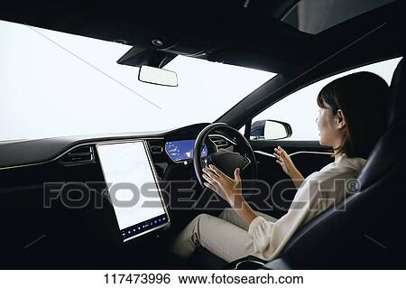 Japanese woman in self driving car View Large Photo Image Stock Photograph - Japanese woman in self driving car. Fotosearch