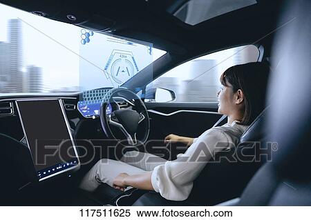 Japanese woman in self driving car View Large Photo Image Stock Photography - Japanese woman in self driving car. Fotosearch