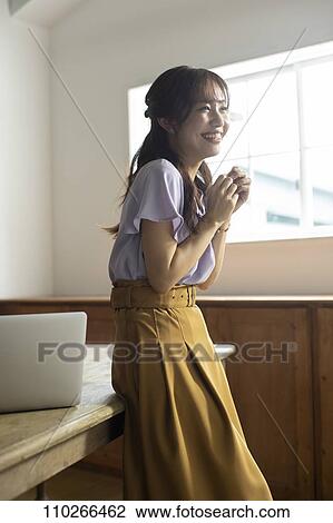 Japanese woman in the office View Large Photo Image Stock Image - Japanese woman in the office. Fotosearch