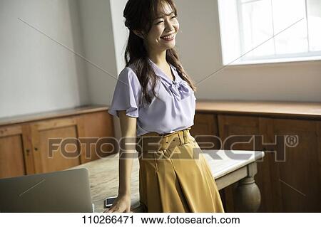 Japanese woman in the office View Large Photo Image Stock Image - Japanese woman in the office. Fotosearch