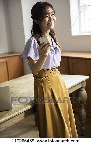 Japanese woman in the office View Large Photo Image Stock Photo - Japanese woman in the office. Fotosearch