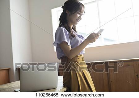 Japanese woman in the office View Large Photo Image Stock Photography - Japanese woman in the office. Fotosearch