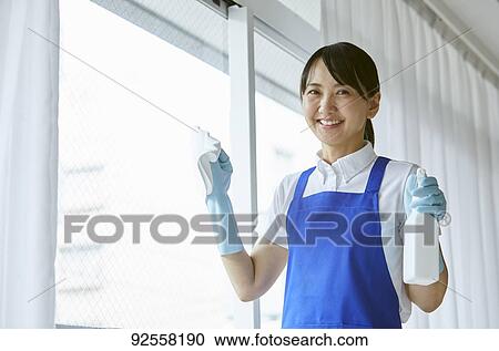 Japanese woman wearing apron at home View Large Photo Image Stock Image - Japanese woman wearing apron at home. Fotosearch