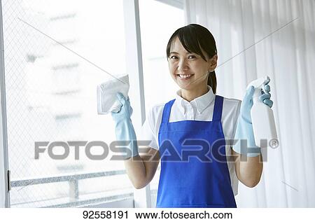 Japanese woman wearing apron at home View Large Photo Image Stock Image - Japanese woman wearing apron at home. Fotosearch