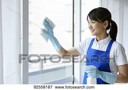 Japanese woman wearing apron at home View Large Photo Image Stock Photo - Japanese woman wearing apron at home. Fotosearch