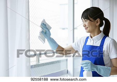 Japanese woman wearing apron at home View Large Photo Image Stock Photo - Japanese woman wearing apron at home. Fotosearch