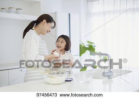 Japanese woman with daughter in the kitchen View Large Photo Image Stock Image - Japanese woman with daughter in the kitchen. Fotosearch