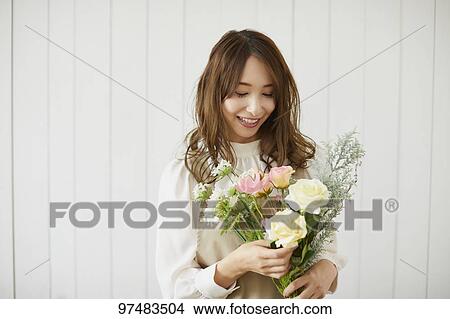 Japanese woman with flowers View Large Photo Image Picture - Japanese woman with flowers. Fotosearch