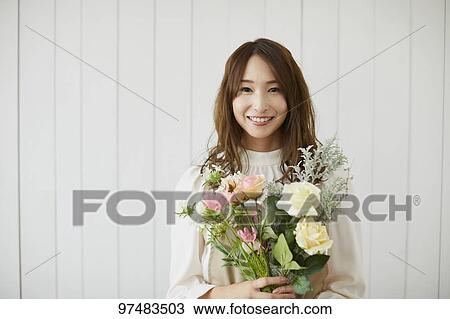Japanese woman with flowers View Large Photo Image Stock Image - Japanese woman with flowers. Fotosearch