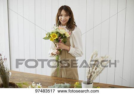 Japanese woman with flowers View Large Photo Image Stock Photo - Japanese woman with flowers. Fotosearch