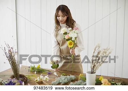 Japanese woman with flowers View Large Photo Image Stock Photo - Japanese woman with flowers. Fotosearch