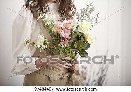 Stock Photo - Japanese woman with flowers. Fotosearch