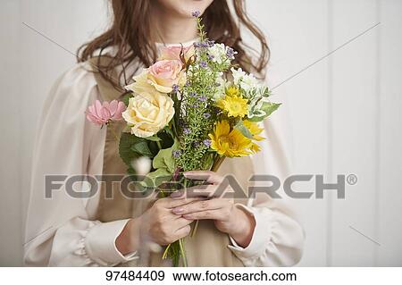 Stock Photo - Japanese woman with flowers. Fotosearch