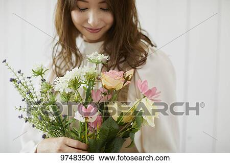 Japanese woman with flowers View Large Photo Image Stock Photograph - Japanese woman with flowers. Fotosearch