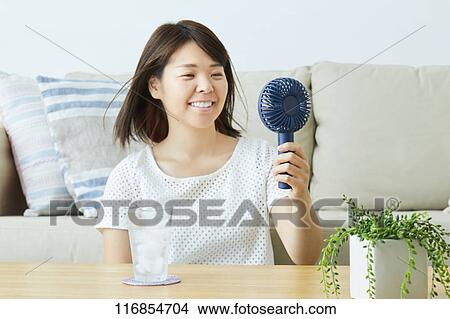 Japanese woman with portable fan View Large Photo Image Picture - Japanese woman with portable fan. Fotosearch