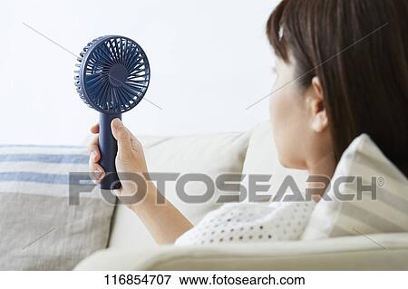 Japanese woman with portable fan View Large Photo Image Stock Photo - Japanese woman with portable fan. Fotosearch