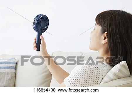 Japanese woman with portable fan View Large Photo Image Stock Photo - Japanese woman with portable fan. Fotosearch