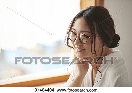 Japanese woman working at a cafe View Large Photo Image Picture - Japanese woman working at a cafe. Fotosearch