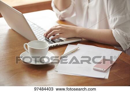 Japanese woman working at a cafe View Large Photo Image Stock Image - Japanese woman working at a cafe. Fotosearch