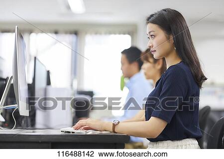 Japanese woman working in the office View Large Photo Image Stock Image - Japanese woman working in the office. Fotosearch