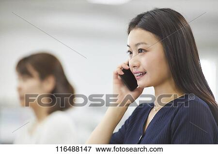 Japanese woman working in the office View Large Photo Image Stock Photo - Japanese woman working in the office. Fotosearch