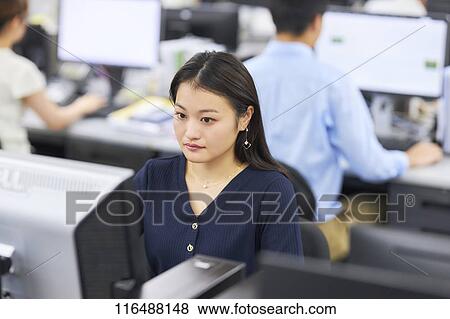 Japanese woman working in the office View Large Photo Image Stock Photo - Japanese woman working in the office. Fotosearch