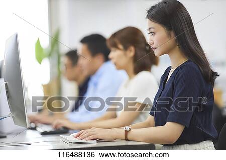 Japanese woman working in the office View Large Photo Image Stock Photograph - Japanese woman working in the office. Fotosearch