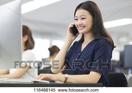 Japanese woman working in the office View Large Photo Image Stock Photography - Japanese woman working in the office. Fotosearch