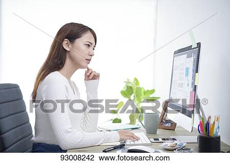 Japanese woman working remotely View Large Photo Image Stock Image - Japanese woman working remotely. Fotosearch