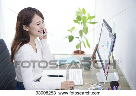 Japanese woman working remotely View Large Photo Image Stock Image - Japanese woman working remotely. Fotosearch