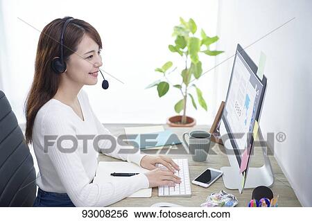 Japanese woman working remotely View Large Photo Image Stock Photograph - Japanese woman working remotely. Fotosearch
