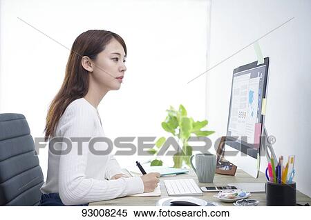 Japanese woman working remotely View Large Photo Image Stock Photography - Japanese woman working remotely. Fotosearch