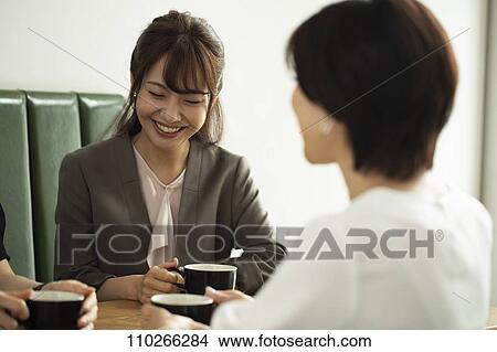 Picture - Japanese women at a cafe. Fotosearch