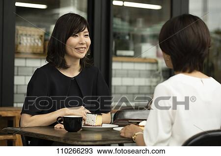 Japanese women at a cafe View Large Photo Image Stock Image - Japanese women at a cafe. Fotosearch